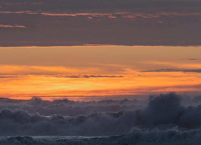 Sunset over rough sea